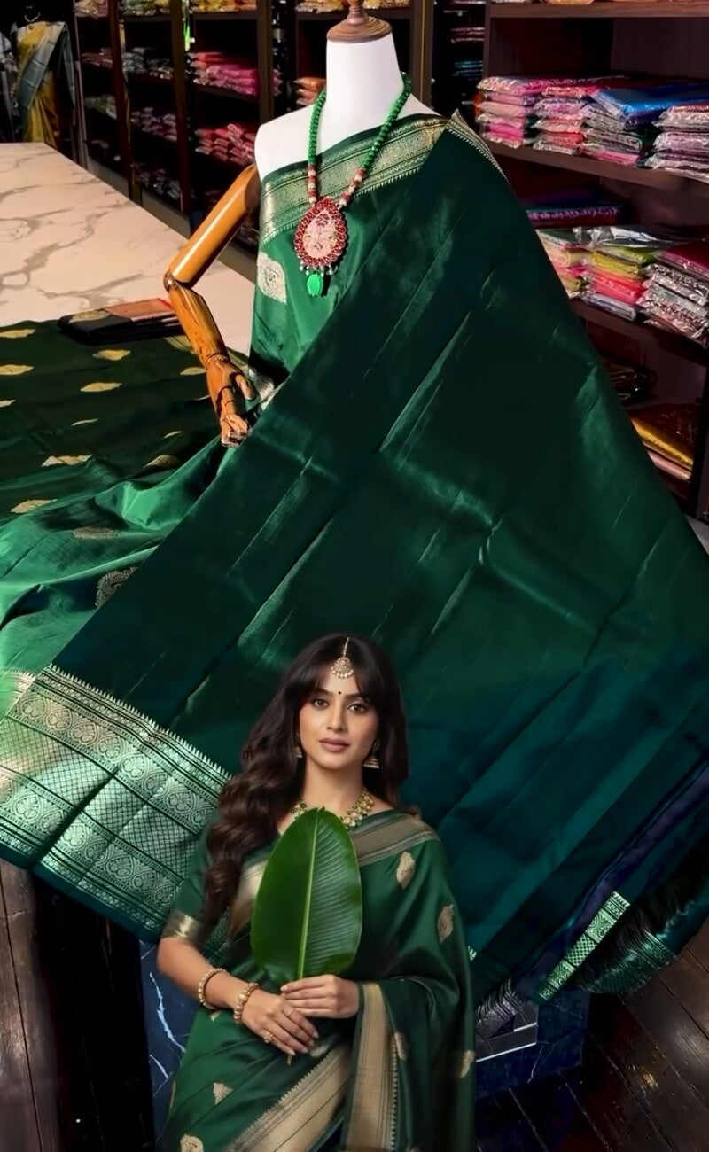 Beauteous Dark Green Soft Banarasi Silk Saree With Gleaming Blouse Piece
