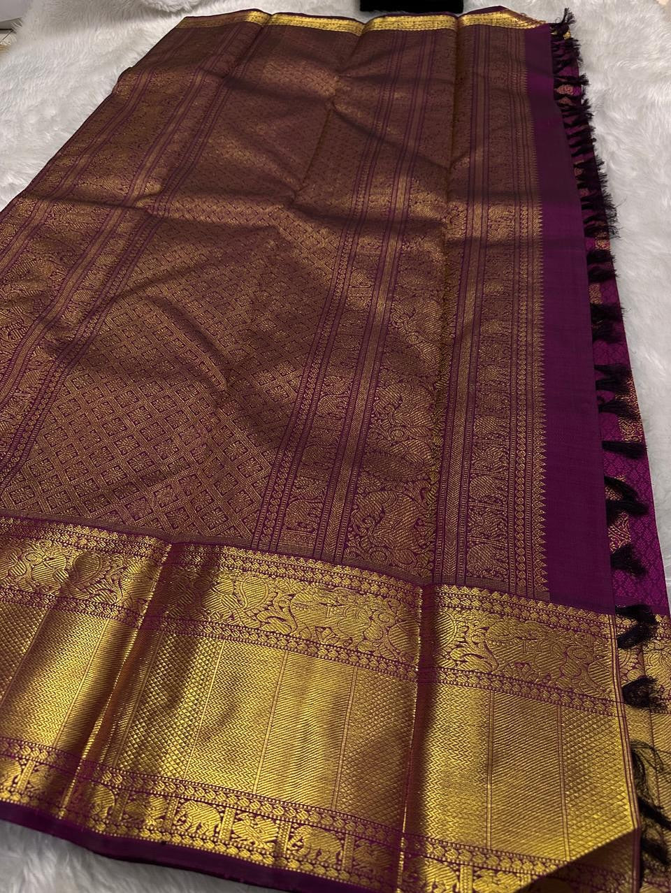 Cynosure Purple Soft Banarasi Silk Saree With Sempiternal Blouse Piece