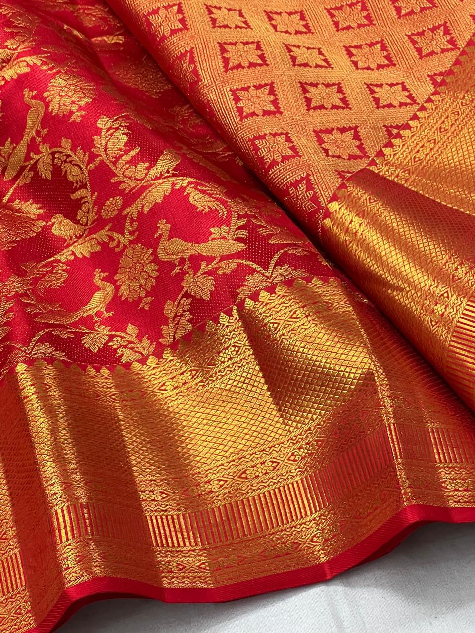 Cynosure Red Soft Banarasi Silk Saree With Desultory Blouse Piece