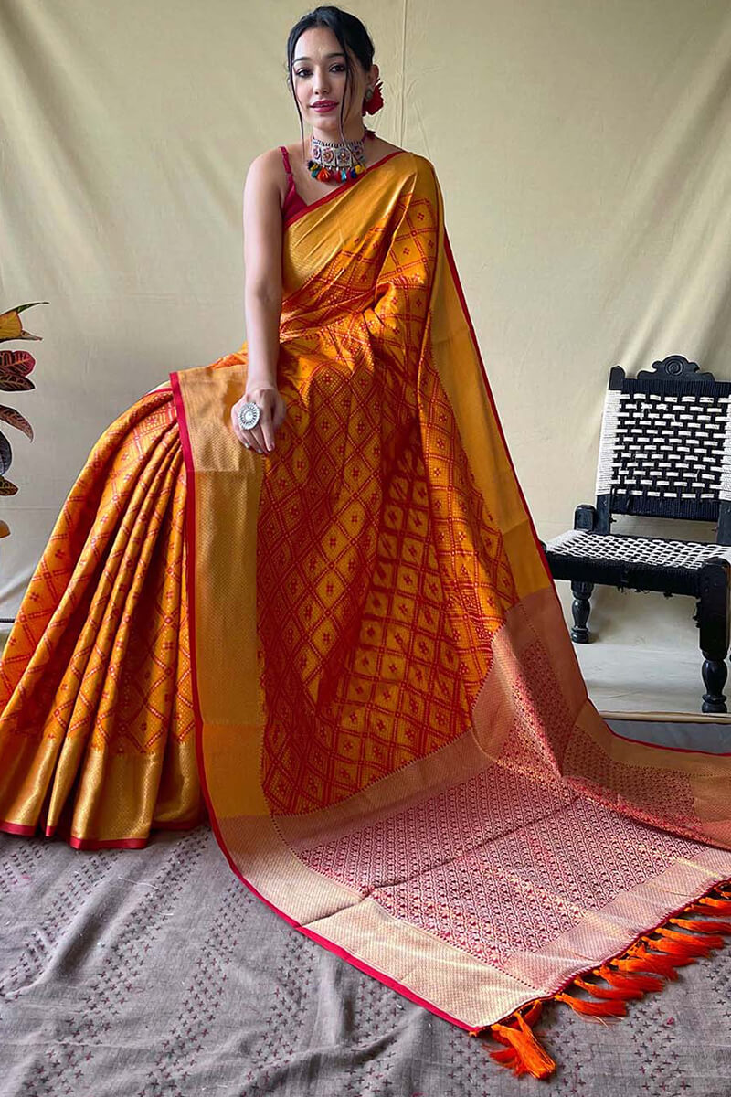 Beauteous Mustard Patola Silk Saree with Delectable Blouse Piece