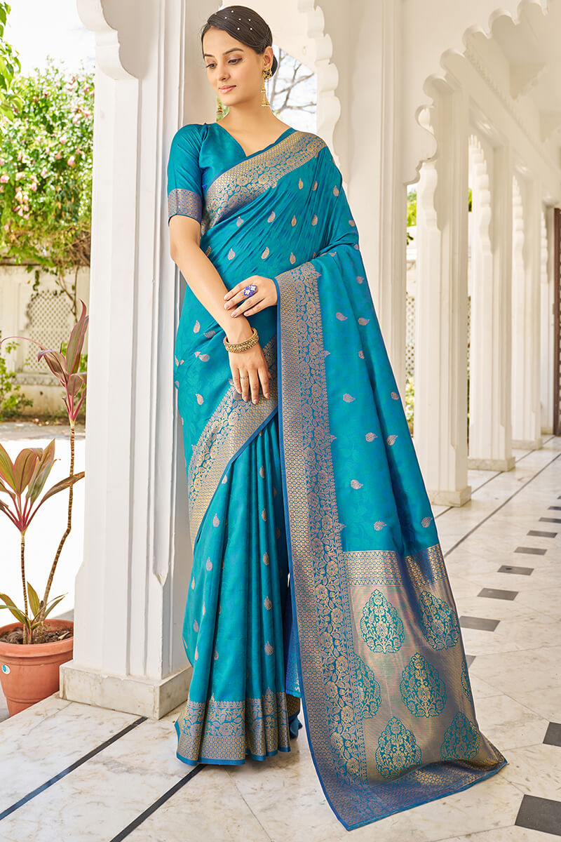 Cynosure Firozi Kanjivaram Silk Saree With Comely Blouse Piece
