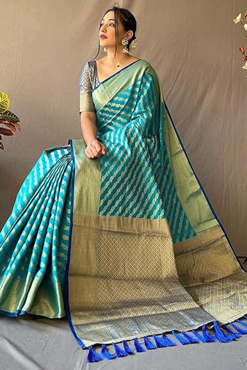 Symmetrical Firozi Soft Banarasi Silk Saree With Snazzy Blouse Piece