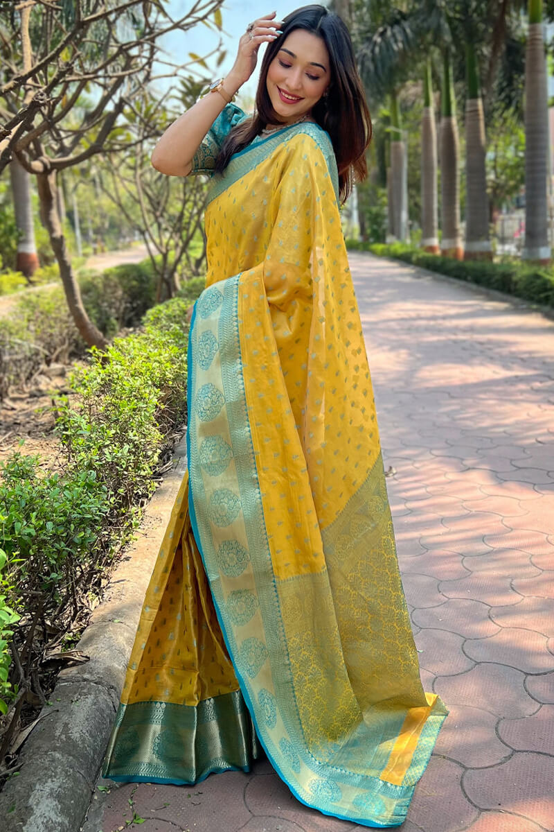 Eye-catching Yellow Soft Banarasi Tissue Silk Saree With Cynosure Blouse Piece