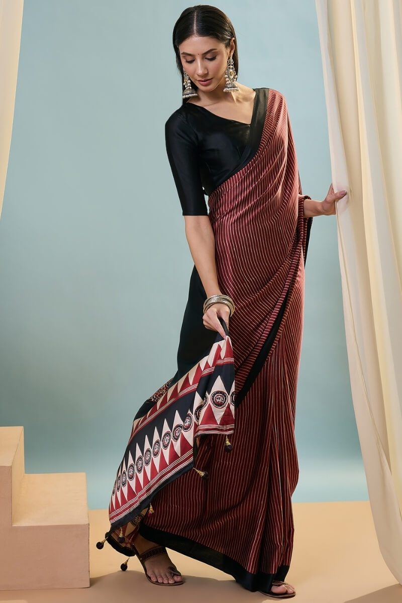 Enthralling Maroon Ajrakh Printed Semi Modal Silk Saree With Desuetude Blouse Piece