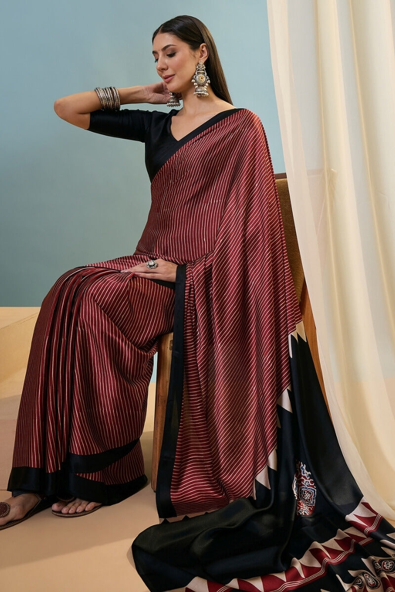 Enthralling Maroon Ajrakh Printed Semi Modal Silk Saree With Desuetude Blouse Piece