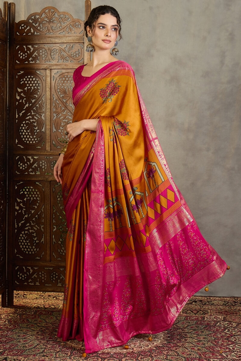 Amiable Mustard Ajrakh Printed Semi Modal Silk Saree With Gratifying Blouse Piece