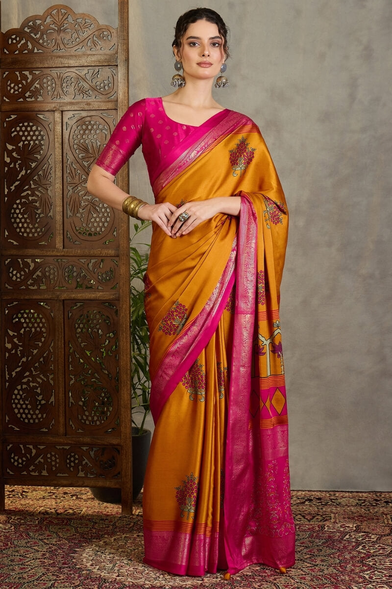 Amiable Mustard Ajrakh Printed Semi Modal Silk Saree With Gratifying Blouse Piece