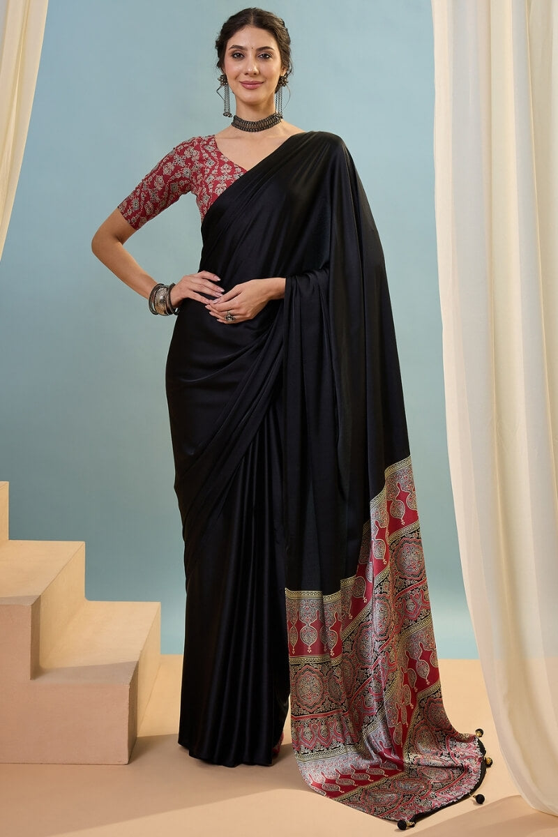 Innovative Black Ajrakh Printed Semi Modal Silk Saree With Snazzy Blouse Piece