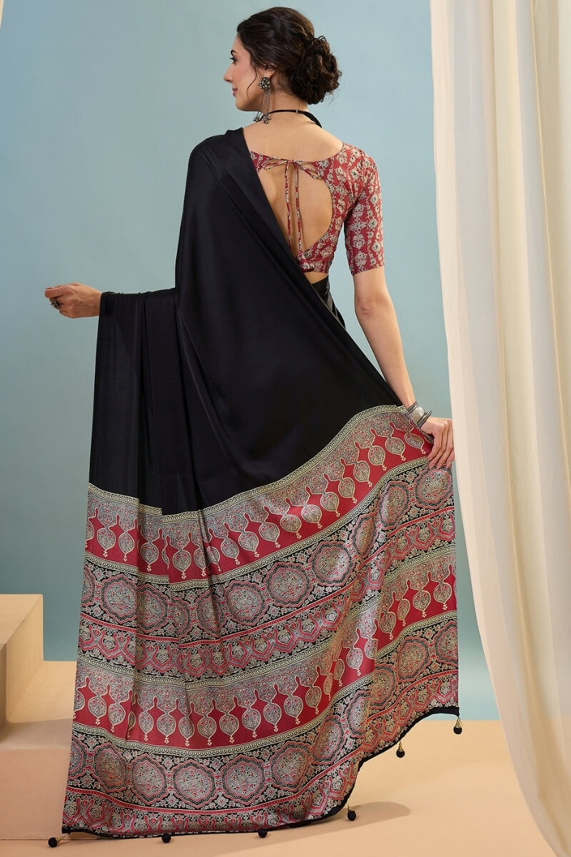 Innovative Black Ajrakh Printed Semi Modal Silk Saree With Snazzy Blouse Piece