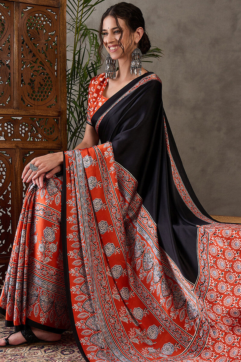 Enticing Black Ajrakh Printed Semi Modal Silk Saree With Winsome Blouse Piece