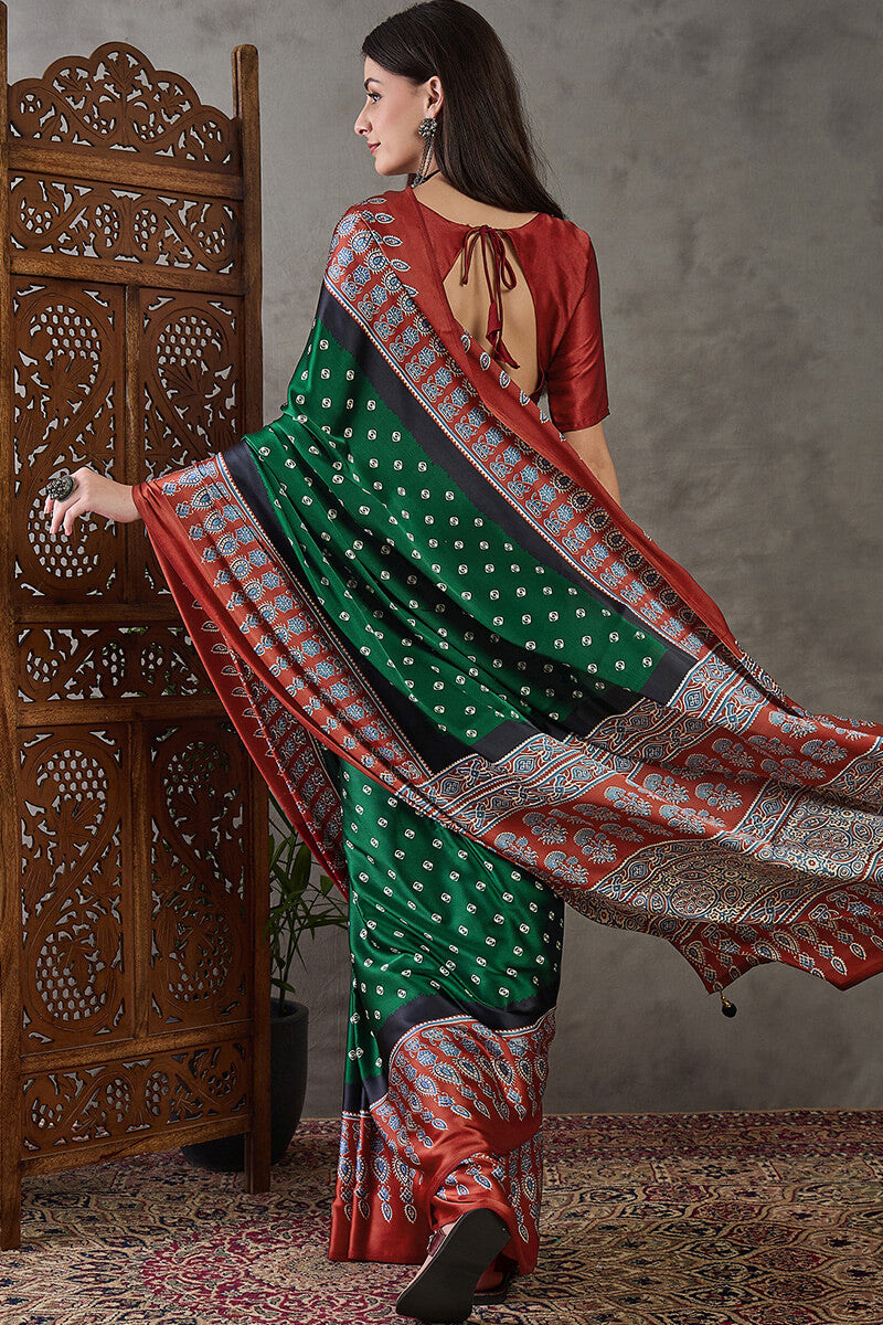 Deserving Dark Green Ajrakh Printed Semi Modal Silk Saree With Stunner Blouse Piece