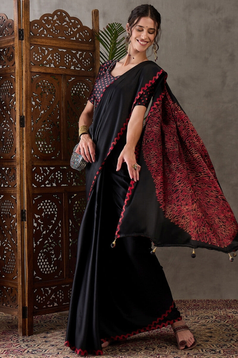 Super classy Black Ajrakh Printed Semi Modal Silk Saree With Symmetrical Blouse Piece