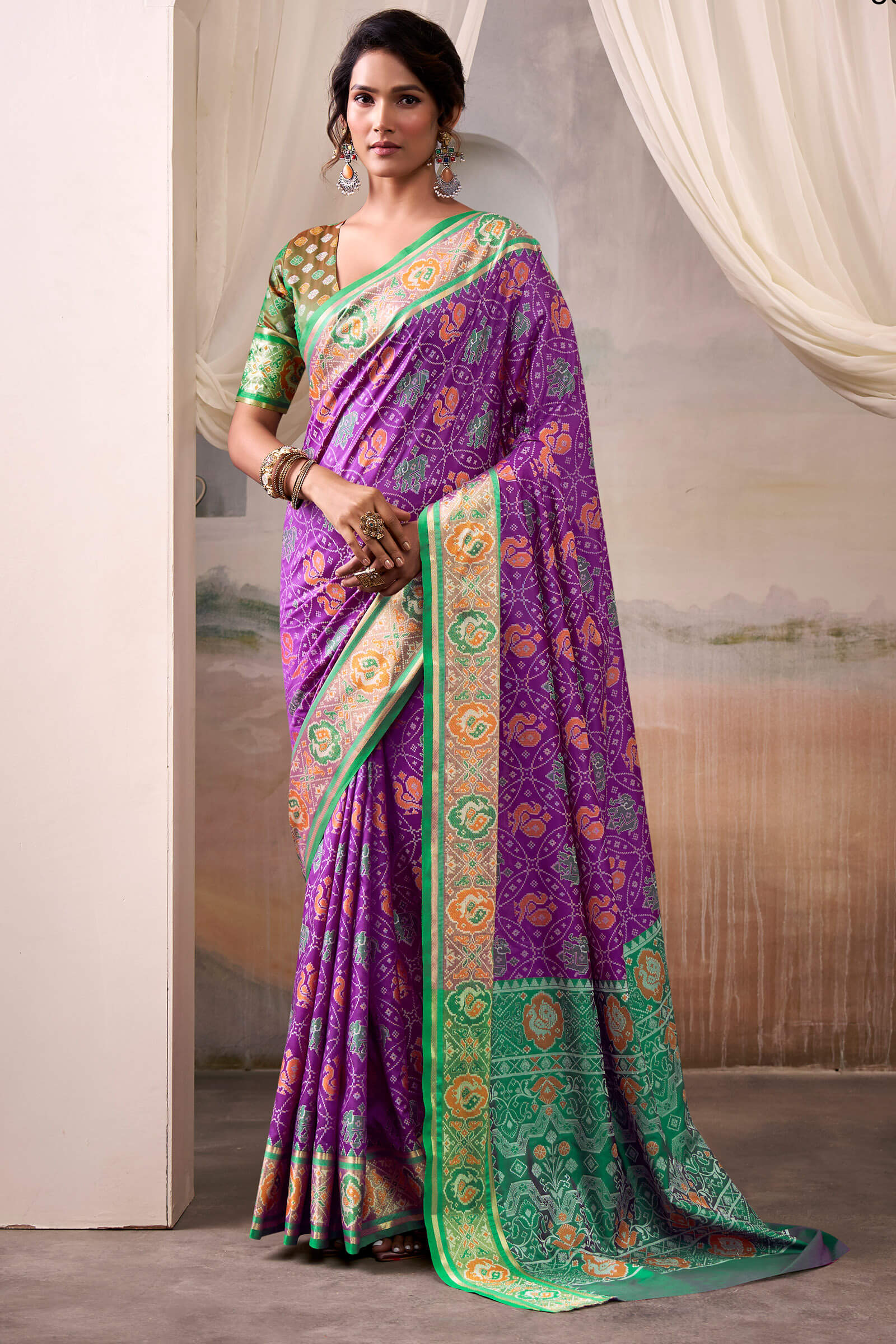 Engrossing Purple Patola Silk Saree With Fairytale Blouse Piece