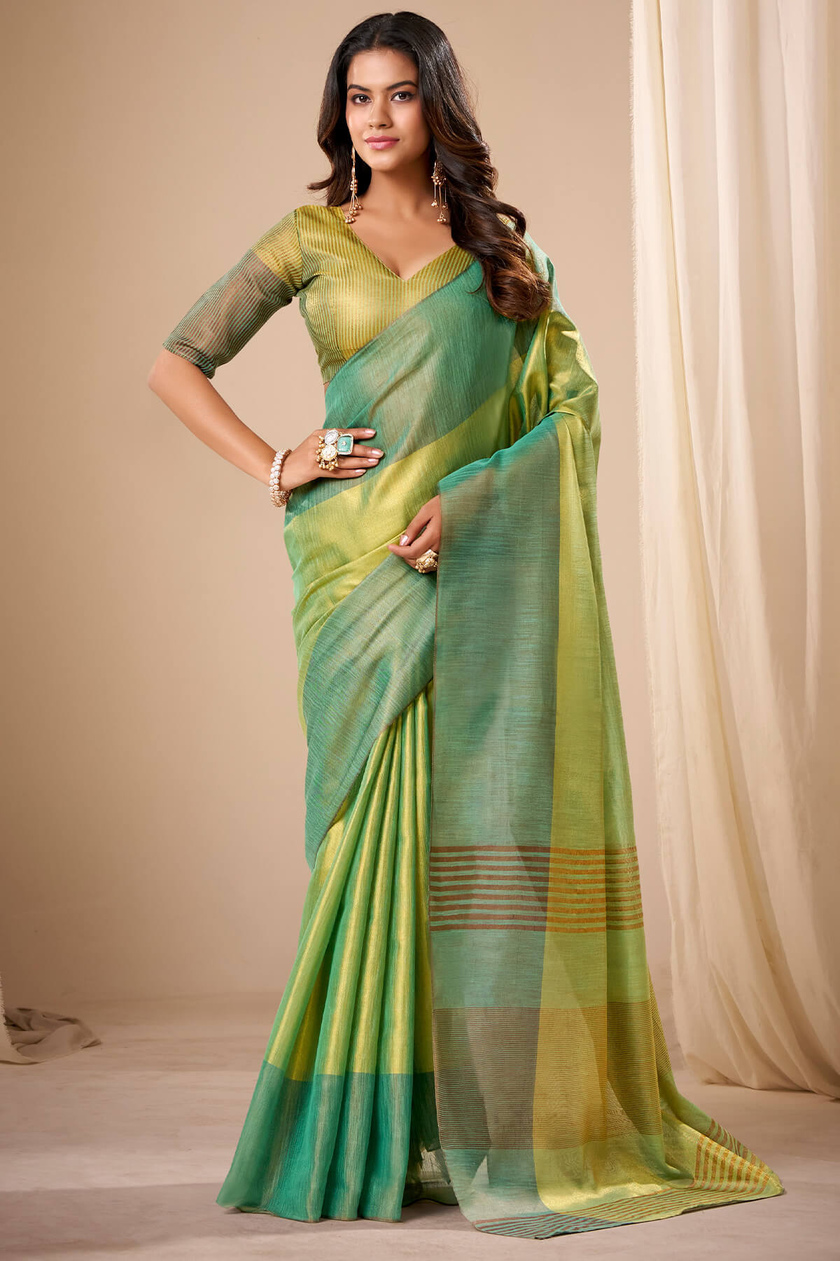 Murmurous Green Banarasi Tissue Silk Saree With Sonorous Blouse Piece