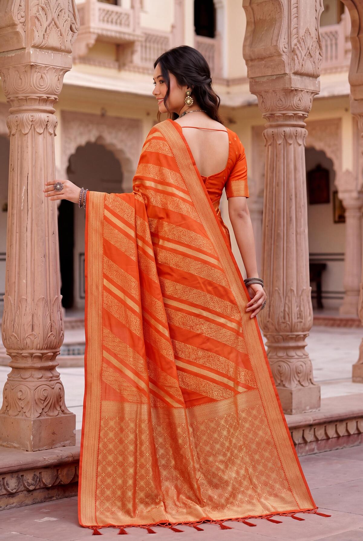 Comely Orange Banarasi Khadi Silk Saree With Jubilant Blouse Piece