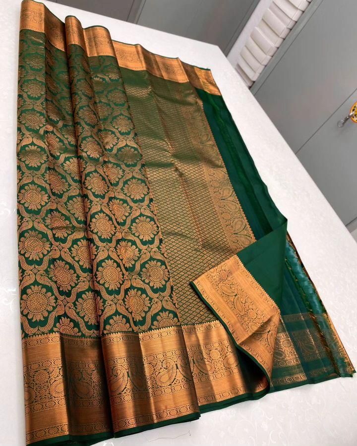 Intricate Dark Green Soft Silk Saree With Glorious Blouse Piece
