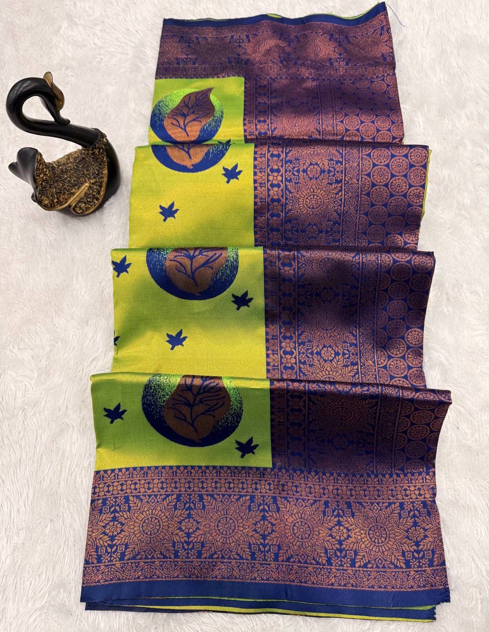 Enigmatic Parrot Soft Silk Saree With Bewitching Blouse Piece