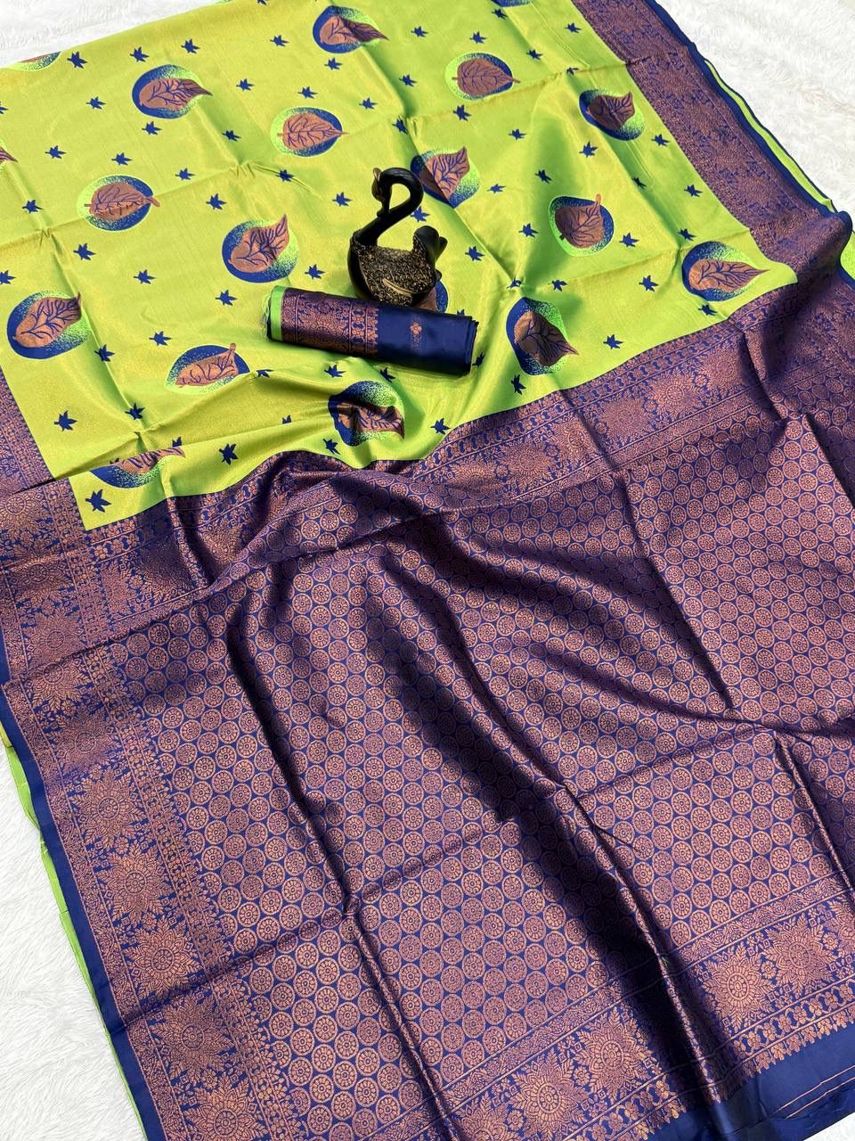 Enigmatic Parrot Soft Silk Saree With Bewitching Blouse Piece