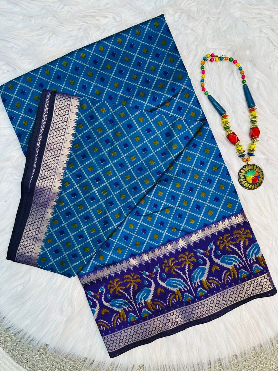 Dalliance Firozi Soft Printed Patola Silk Saree with Tantalizing Blouse Piece