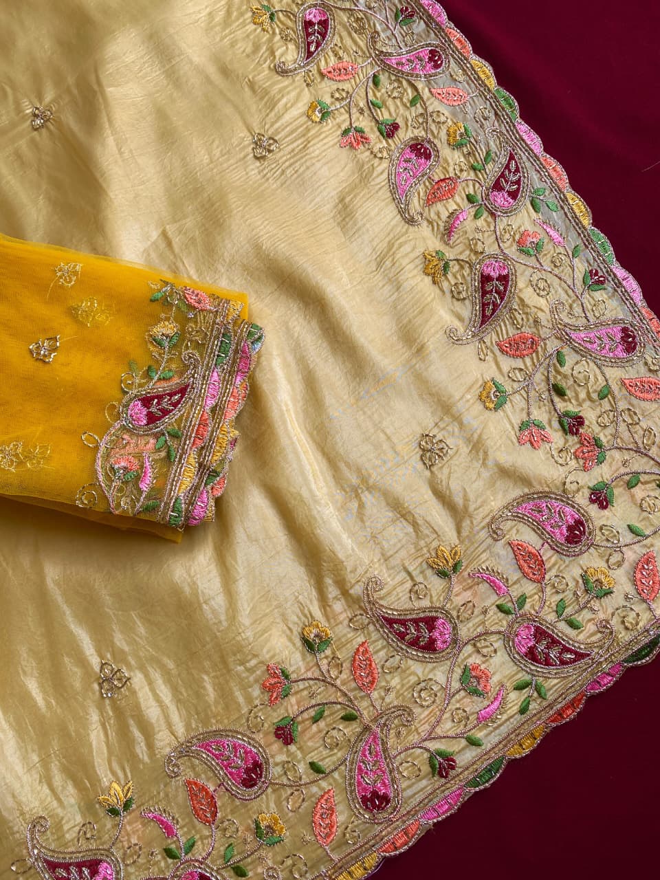 Cynosure Yellow Embroidery Work Crush Silk Saree With Desultory Blouse Piece