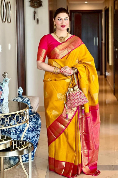 Prominent Yellow Soft Banarasi Silk Saree With Blissful Blouse Piece