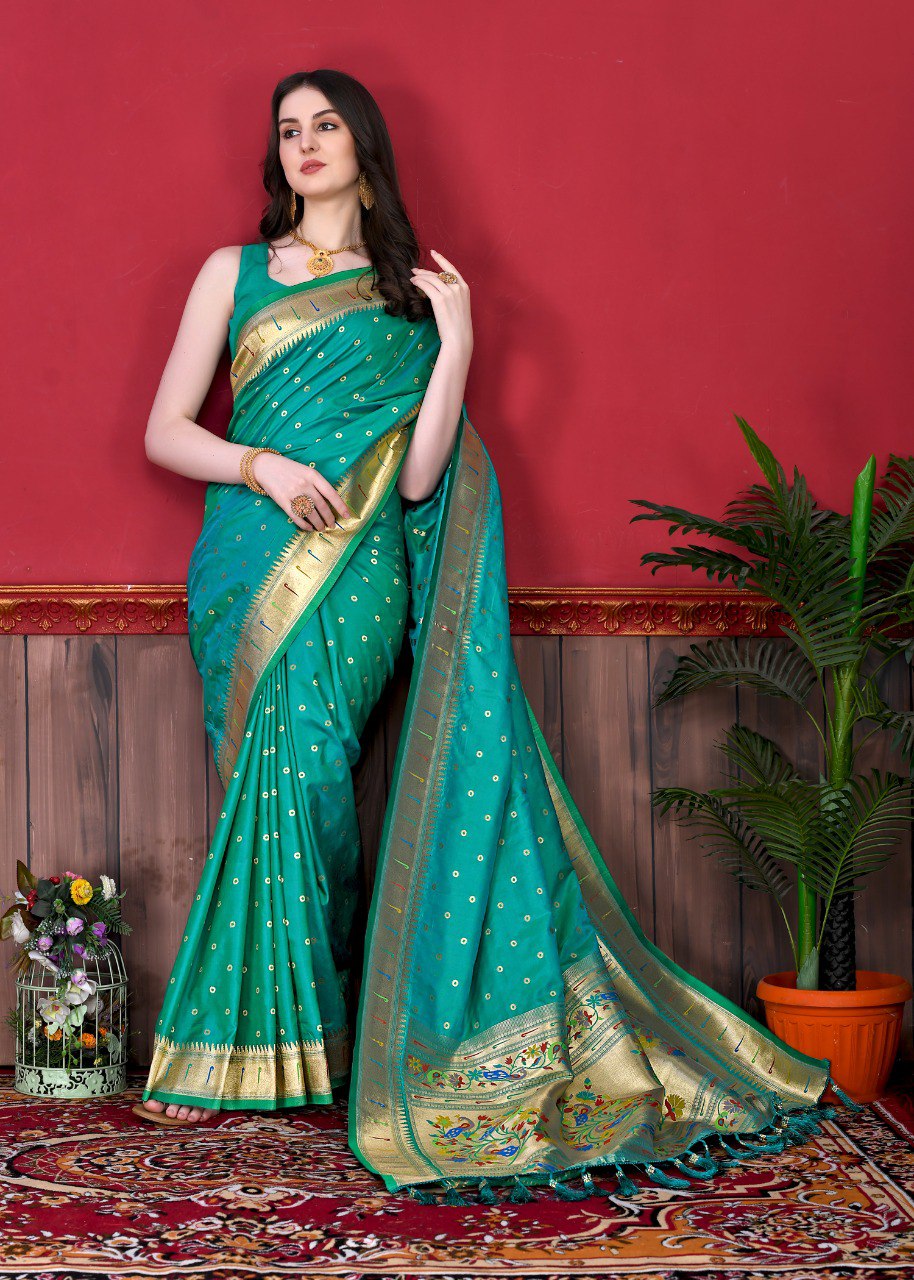Eye-catching Rama Paithani Silk Saree With Ethnic Blouse Piece