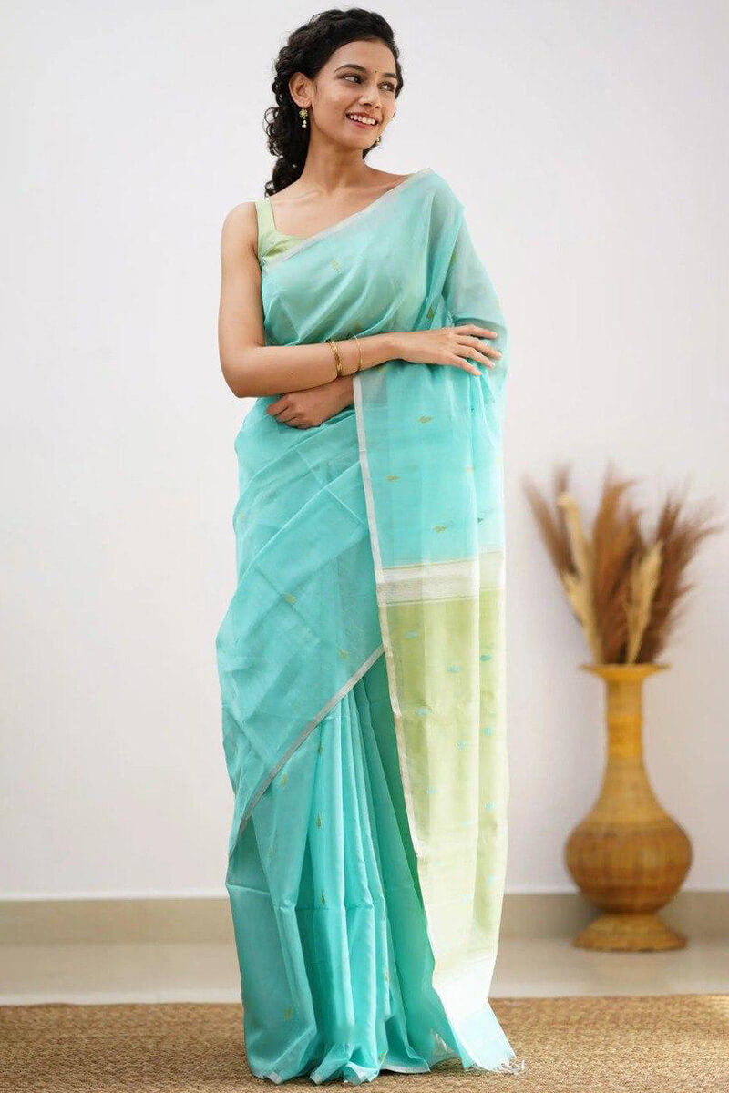 Mellifluous Sea Green Cotton Silk Saree With Staggering Blouse Piece