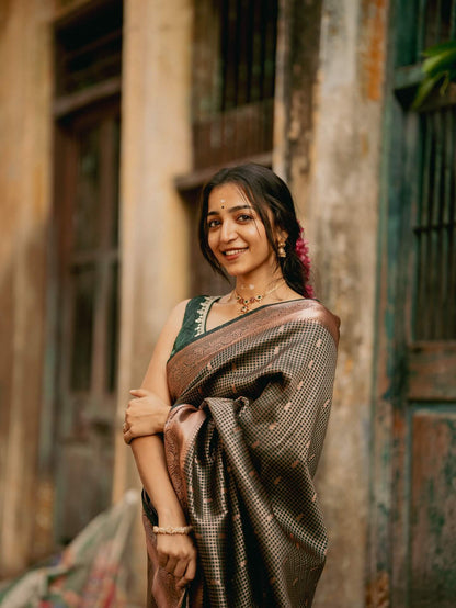 Impressive Dark Green Soft Silk Saree With Gossamer Blouse Piece
