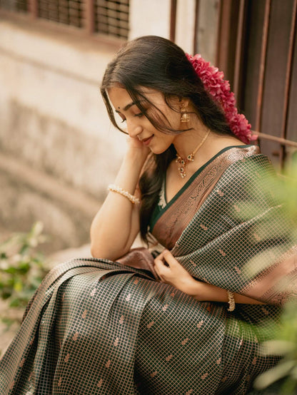 Impressive Dark Green Soft Silk Saree With Gossamer Blouse Piece