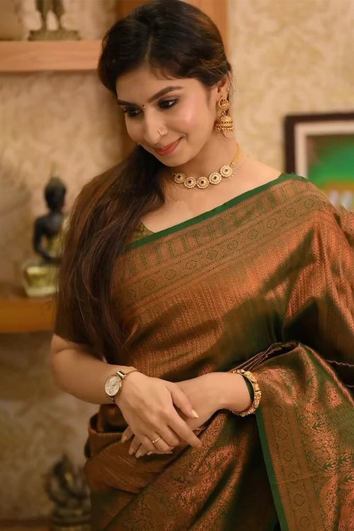 Load image into Gallery viewer, Lassitude Dark Green Soft Silk Saree With Devastating Blouse Piece
