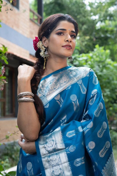 Ornate Blue Soft Silk Saree With Denouement Blouse Piece