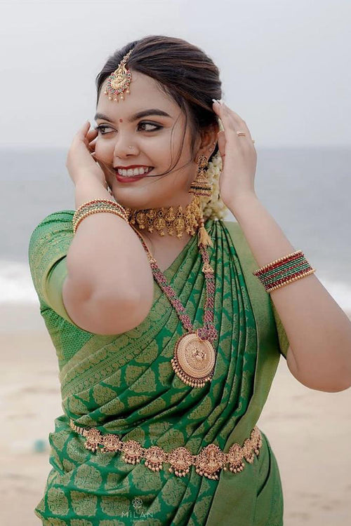 Load image into Gallery viewer, Stunner Green Soft Silk Saree With Opulent Blouse Piece
