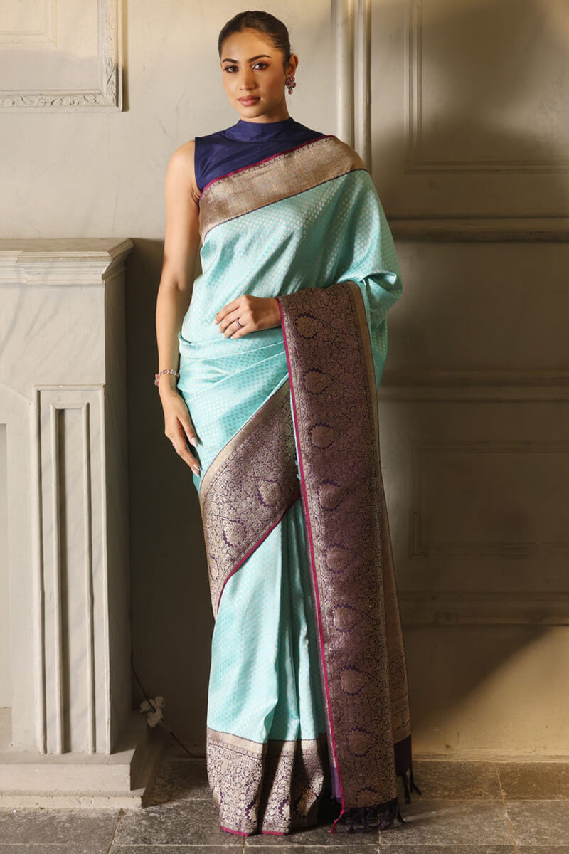 Enigmatic Firozi Soft Silk Saree With Glittering Blouse Piece