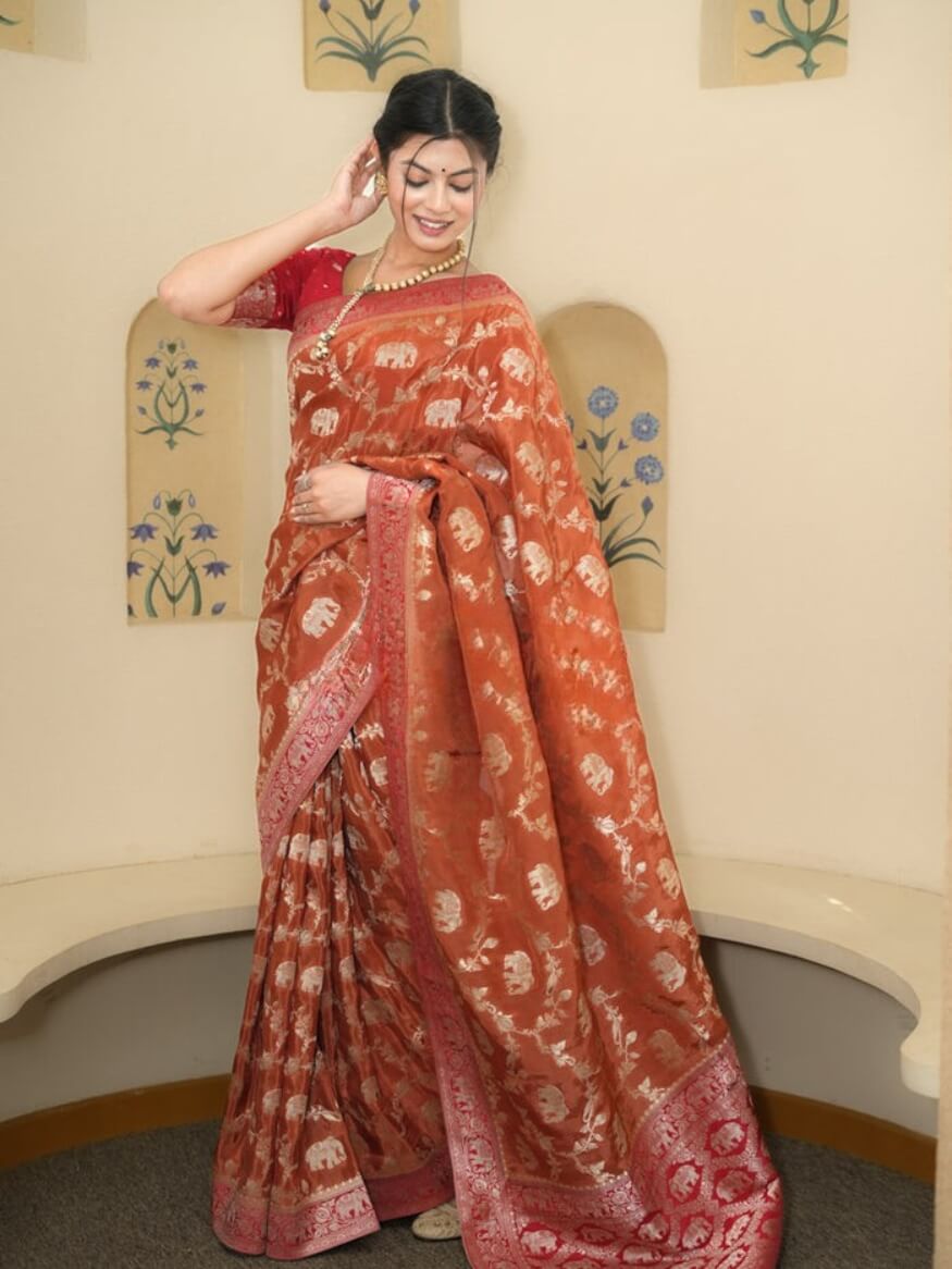 Classy Orange Soft Silk Saree With Piquant Blouse Piece