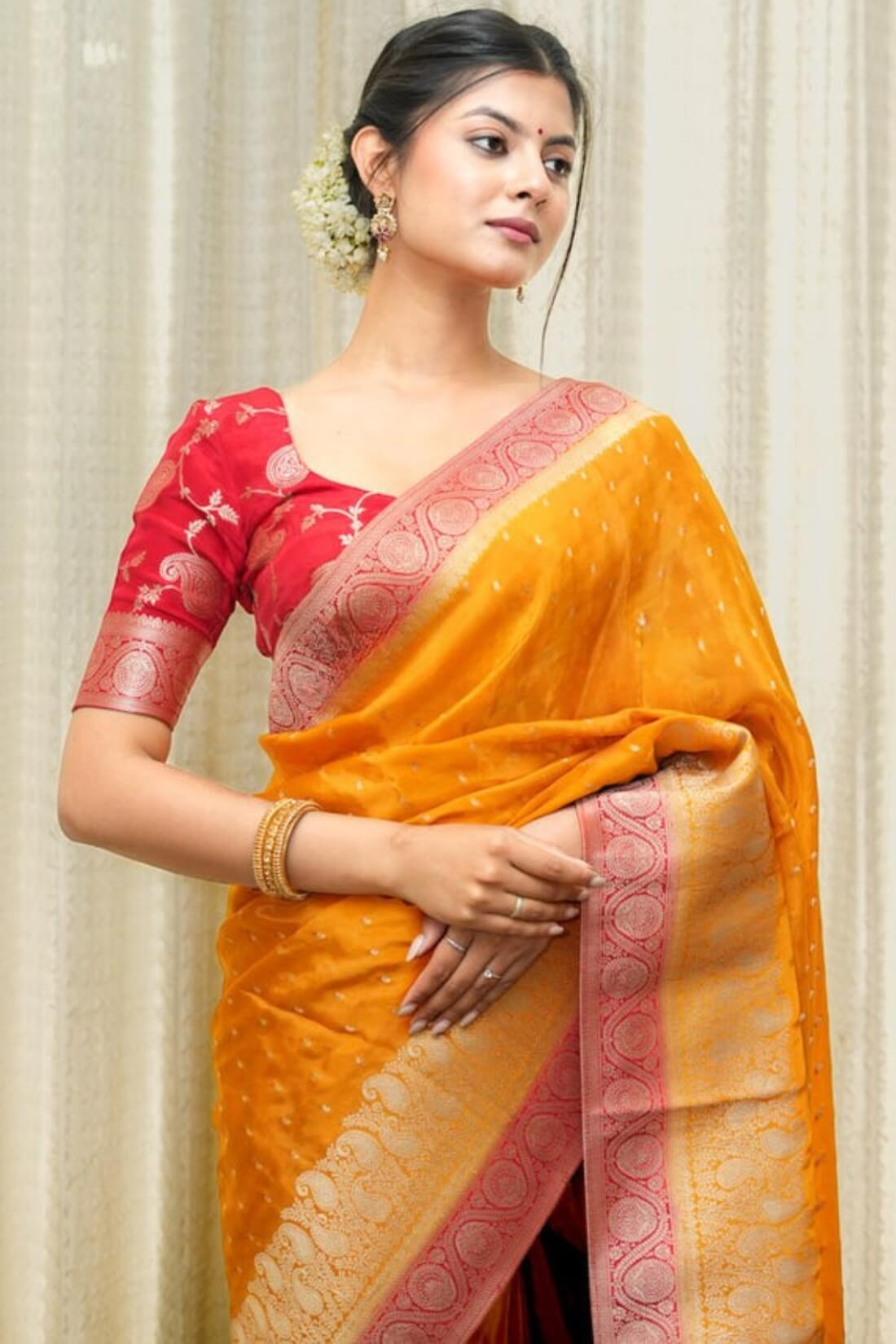 Lustrous Orange Soft Silk Saree With Elaborate Blouse Piece