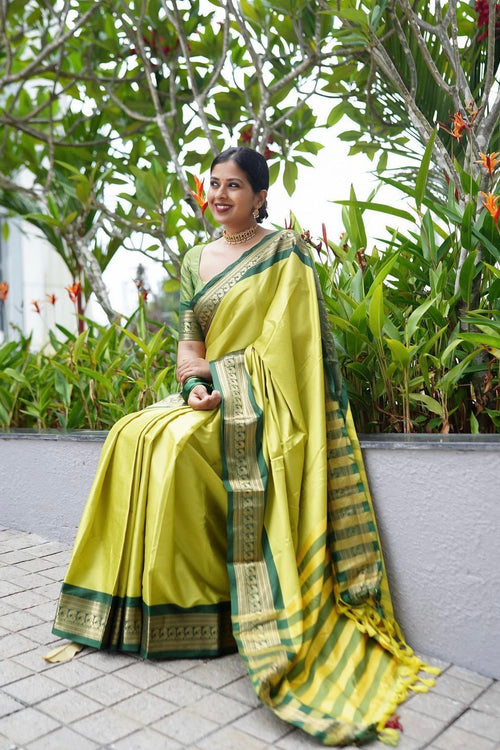 Load image into Gallery viewer, Evanescent Perrot Soft Silk Saree With Chatoyant Blouse Piece
