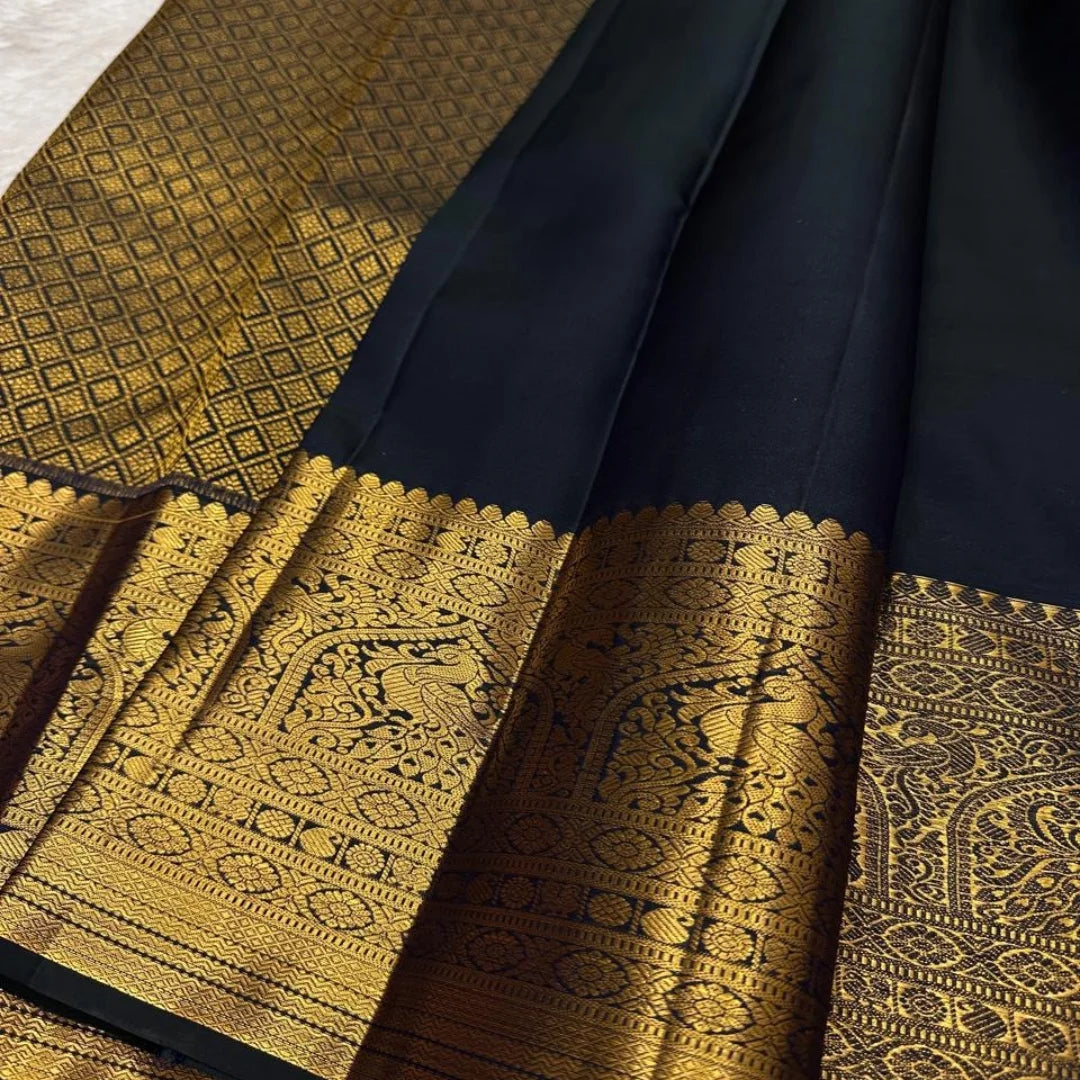 Divine Black Soft Banarasi Silk Saree With Delightful Blouse Piece