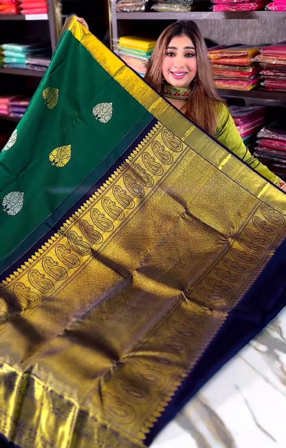 Eloquence Dark Green Soft Banarasi Silk Saree With Ineffable Blouse Piece