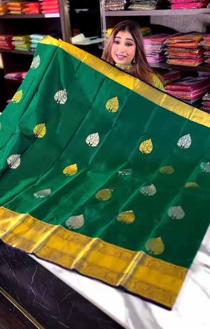 Eloquence Dark Green Soft Banarasi Silk Saree With Ineffable Blouse Piece