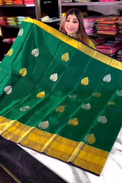 Eloquence Dark Green Soft Banarasi Silk Saree With Ineffable Blouse Piece