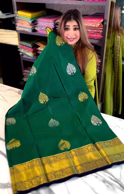 Eloquence Dark Green Soft Banarasi Silk Saree With Ineffable Blouse Piece