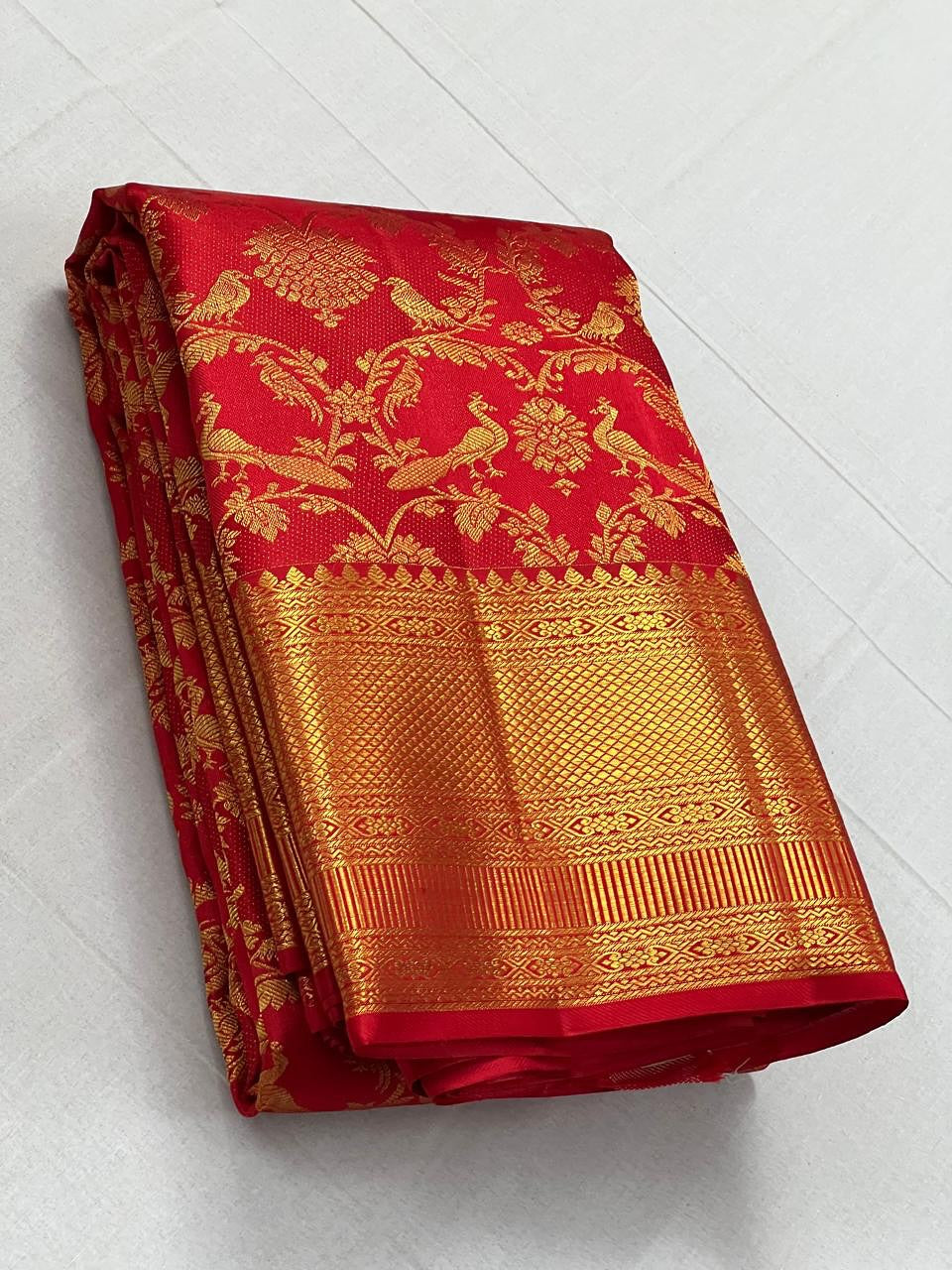 Cynosure Red Soft Banarasi Silk Saree With Desultory Blouse Piece
