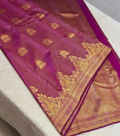 Hypnotic Dark Pink Pure Zari Weaving Banarasi Silk Saree With Desiring Blouse Piece