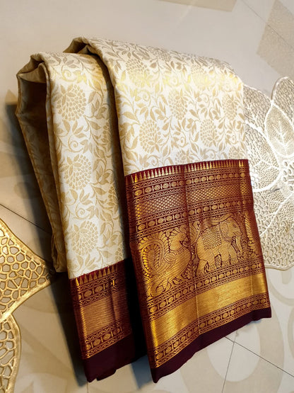 Cynosure Beige Pure Banarasi Silk Saree With Zephyr Blouse Piece