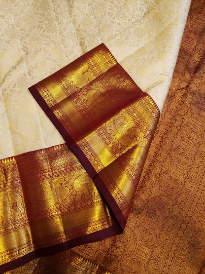 Cynosure Beige Pure Banarasi Silk Saree With Zephyr Blouse Piece