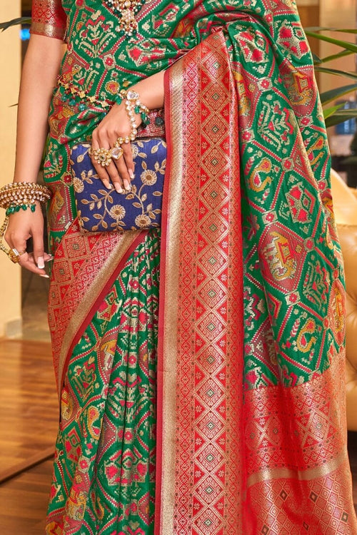 Load image into Gallery viewer, Classy Dark Green Patola Silk Saree with Extraordinary Blouse Piece
