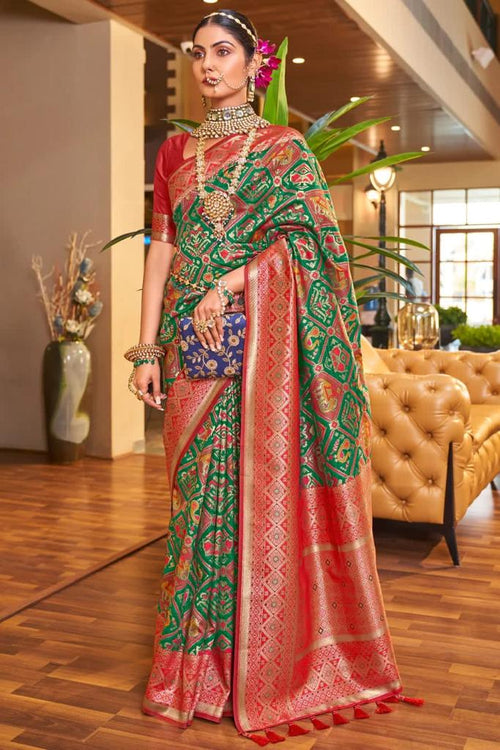 Load image into Gallery viewer, Classy Dark Green Patola Silk Saree with Extraordinary Blouse Piece
