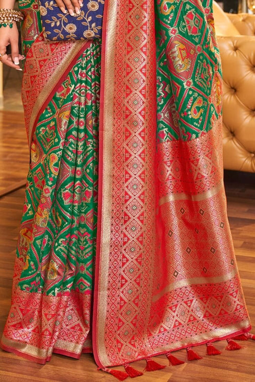 Load image into Gallery viewer, Classy Dark Green Patola Silk Saree with Extraordinary Blouse Piece
