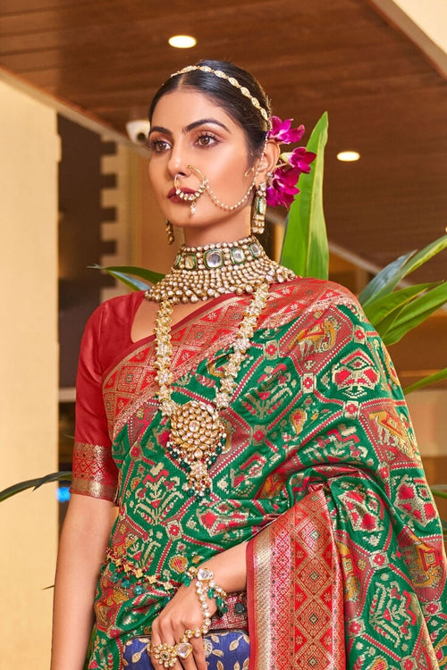 Load image into Gallery viewer, Classy Dark Green Patola Silk Saree with Extraordinary Blouse Piece
