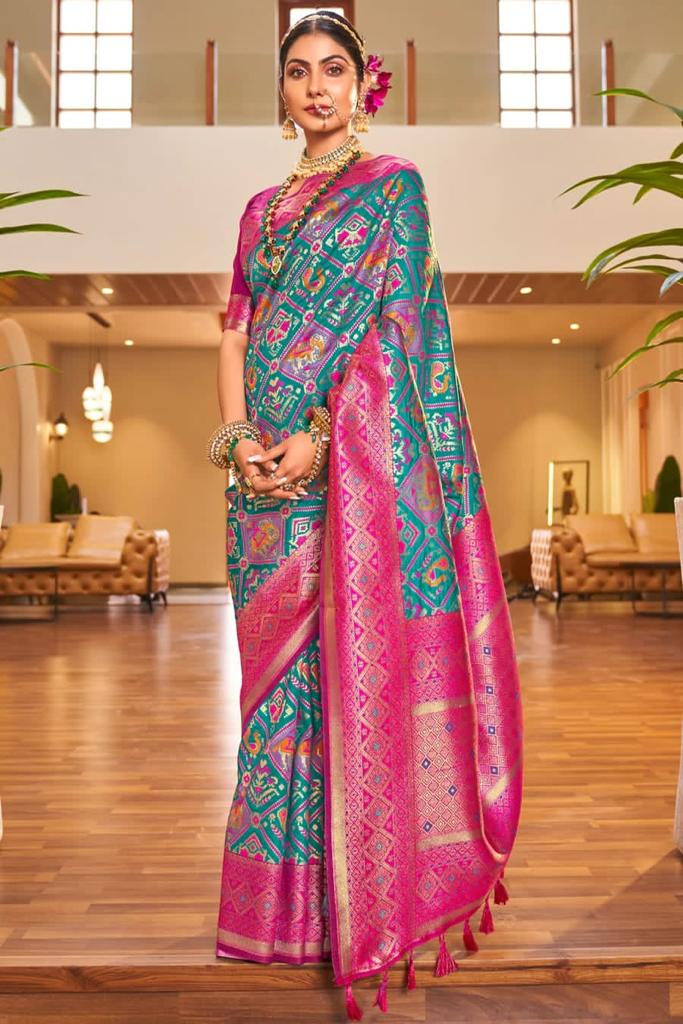 Outstanding Turquoise Patola Silk Saree with Invaluable Blouse Piece